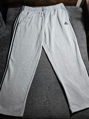 Adidas gray sweatpants with classic black 3-stripe detail and embroidered logo